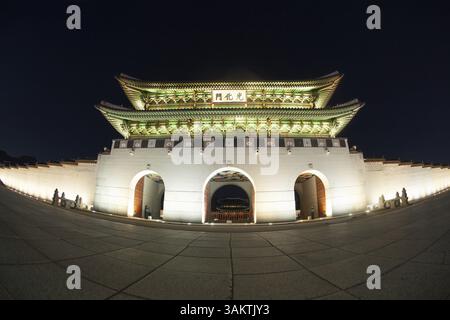 Wide angle shot of the illuminated Gwanghwamun Gate at night. Sightseeing of Seoul, South Korea, Asia Stock Photo