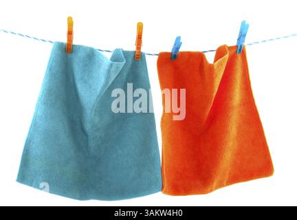 Colorful clothes pins on a laundry rope Stock Photo