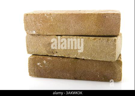 Three stacked bricks to build a house or wall Stock Photo