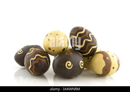 Chocolate easter eggs in different patterns isolated over white Stock Photo