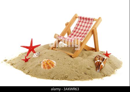Beach with chair starfishes shells and sand Stock Photo