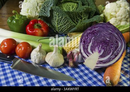 Still life with assortment cabbages on wooden table Stock Photo