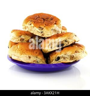 Currant bread rolls stacked on a purple plate Stock Photo