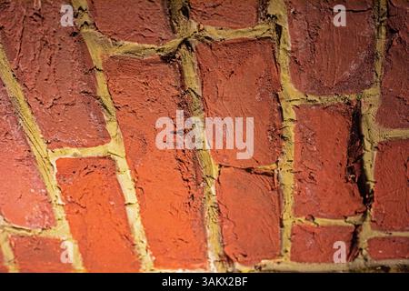 textured wall lined with red brick inside in a cafe Stock Photo