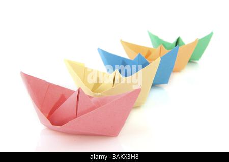 Colorful folder paper boats isolated over white Stock Photo
