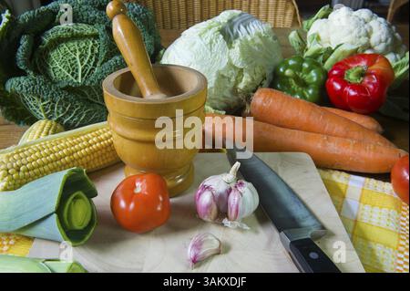 Still life with assortment vegetables on wooden table Stock Photo