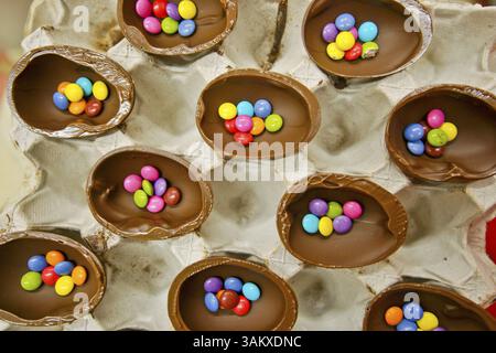 Typical Easter eggs filled with chocolate dragees covered with colored sugar, Forn de Can Pomar. Mallorca. Balearic Islands. Spain. Stock Photo
