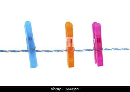 Colorful clothes pins on a laundry rope Stock Photo