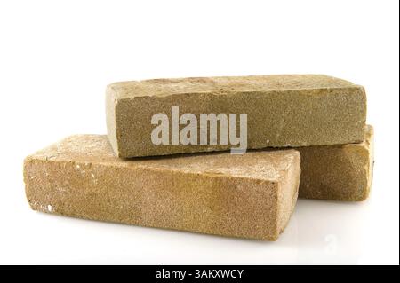 Three bricks stacked and isolated over white Stock Photo