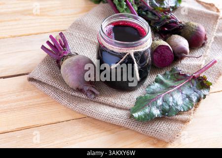 Glass of fresh beetroot juice with vegetables on light background Stock Photo