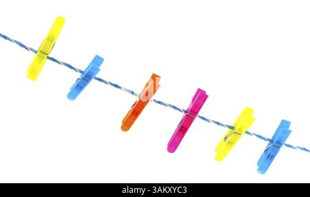 Colorful clothes pins on a laundry rope Stock Photo