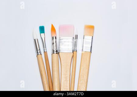 Set of various colorful paint brushes for drawing on white background Stock Photo