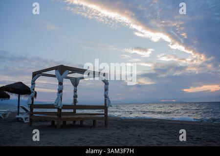 sunrise with a bed on the beach. Spain. Almeria Stock Photo