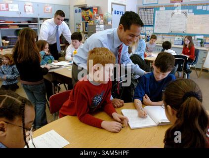 March 2, 2005 - U.S. - KRT LIFESTYLE STORY SLUGGED: FAM-TESTING  KRT PHOTOGRAPH BY CLEM MURRAY/PHILADELPHIA INQUIRER (March 15) Jason Bacani, foreground, one of two ''master teachers'' at the Whitemarsh Elementary School in Philadelphia, Pennsylvania, works with a couple of 3rd grade students during a combined writing class with the students of first-year teacher Jared Gamble, who is in the background working with other students. This ''team teaching'' session with the two third grade teachers is a way to help young teachers learn how to teach better. (jt) 2005 (Diversity) (Credit Image: © Cle Stock Photo