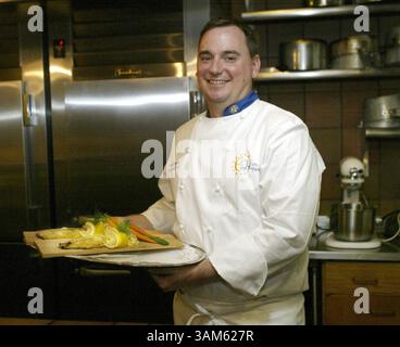 July 13, 2005 - U.S. - KRT FOOD STORY SLUGGED: LAGASSE KRT PHOTOGRAPH BY STEPHANIE SARACENO/KRT (July 13) Finnish chef Mikko Kosonen holds a plate of broiled white trout with spring vegetables and duchess potatoes at the Finnish Embassy in Washington, D.C., on July 8, 2005. (mvw) 2005 (Credit Image: © Stephanie Saraceno/mct/ZUMAPRESS.com) Stock Photo