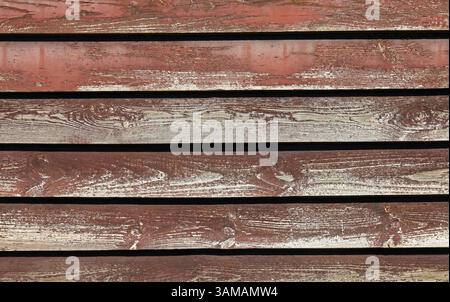 Decorative brown wall, texture, background. Brownish wooden surface made of planks, laid horizontally. Modern fences and enclosures. Wooden covering Stock Photo