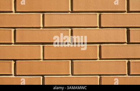 Beige brick wall, texture, background. The wall of a building, made of sand-colored bricks. Brick surface, backdrop. Yellow bricks in construction Stock Photo