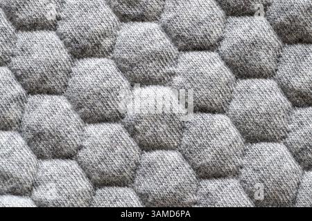 Closeup of gray fabric texture with hexagonal pattern for background Stock Photo