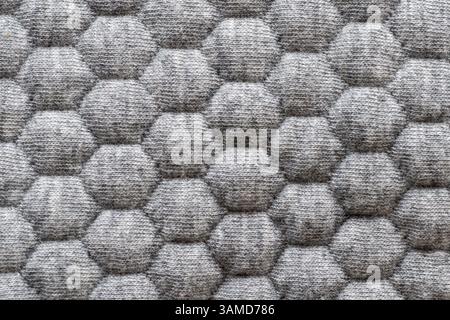 Seamless repetitive hexagonal pattern on soft fabric textile material Stock Photo