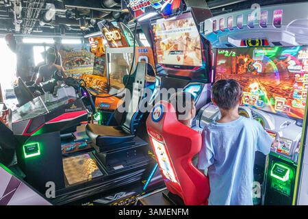 Bahamas,Norwegian Cruise Line NCL Breakaway ship,11-day Eastern Caribbean itinerary,onboard inside interior,Video Arcade,arcade room,kids playing vide Stock Photo