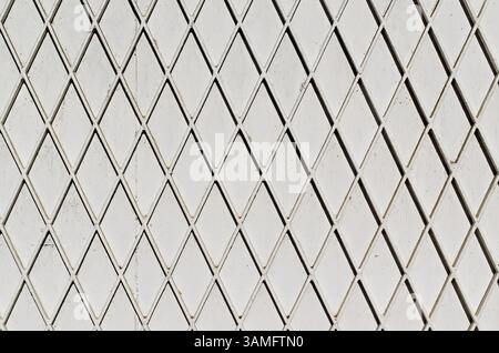 Grid on white metal surface in Tijuca neighborhood, Rio, Brazil Stock Photo
