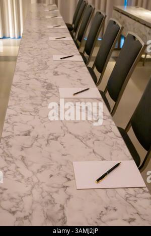 Empty conference room with paper and pens Stock Photo