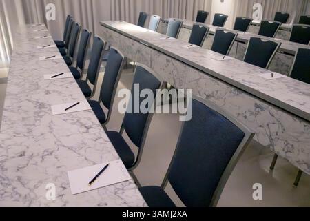 Empty conference room with paper and pens Stock Photo