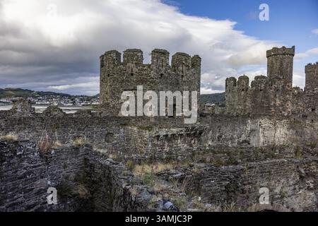 Old castle with massive stone towers and clouds in the background Stock Photo