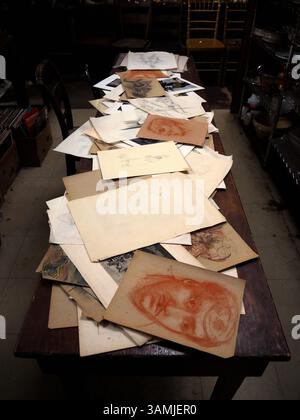 Forgotten faces and paper memories on the table, Brooklyn, New York Stock Photo