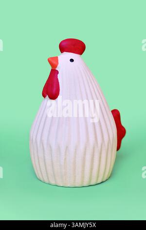 Chicken ceramic decoration object on mint green background Stock Photo