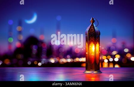 Ramadan Kareem - Arabic Lantern With Crescent Moon In City Night - Abstract Magic Bokeh Lights On Background Stock Photo