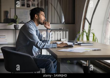Thoughtful pensive business man planning marketing strategy Stock Photo