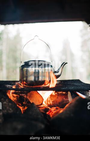 kettle boiling on an open fire outdoors in Sweden Stock Photo