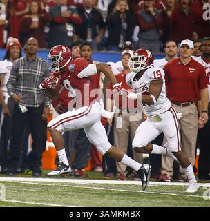 Jan. 2, 2014 - New Orleans, Louisiana, USA - Jan 02 2014 - New Orleans, LA U.S.A -  Alabama WR # 9 Amari Cooper catch a deep pass for a touchdown being chase down by Sooner # 19 Eric Striker ( background Adrian Peterson ) during Allstate Sugar Bowl game between Oklahoma University Sooners and University of Alabama Crimson Tide 45-31 lost at Mercedes - Benz Superdome Louisiana,NO(Credit Image: © Thurman James/Cal Sport Media/ZUMAPRESS.com) Stock Photo