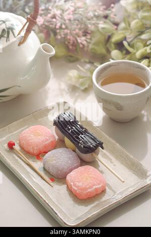 Artisanal Japanese & Chinese Desserts with Tea Stock Photo