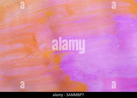 Bright and textured watercolor background in vibrant shades of orange and purple, featuring soft brush strokes and subtle gradients Stock Photo