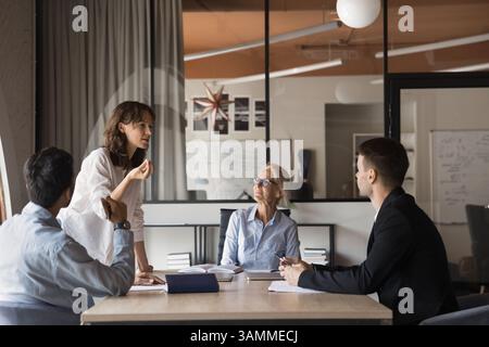 Professional executives working on corporate together at conference Stock Photo