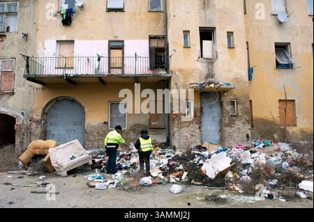 Jan 27, 2014 - Brno, Czech Republic - Two policer officers are searching for used needles used by heroin addicts. This problematic part of Brno is popularly called its Bronx' after one of five boroughs in the city of New York. This Brno suburb is one of the poorest parts of The Czech Republic with mainly Roman migrants who are involved in the illegal drug trade. (Credit Image: © Hans Van Rhoon/ZUMA Wire/ZUMAPRESS.com) Stock Photo