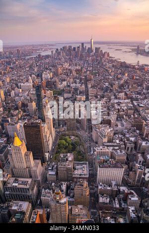 Aerial view of Manhattan's beautiful skyline at sunset with the iconic ...