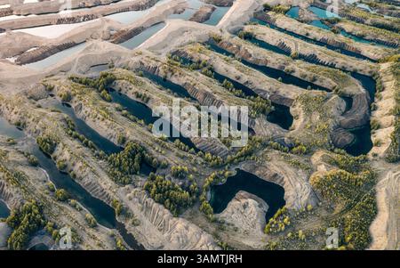 Aerial view of the landscape after gold mining by a special gold washing machine in an industrial quarry in Siberia, Magadan region, Russia. Stock Photo