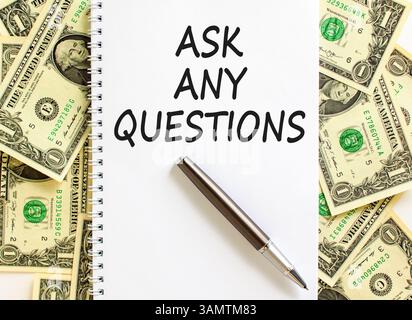 Ask any questions symbol. Concept words Ask any questions on beautiful white note. Beautiful background from dollar bills. Black pen. Business ask any Stock Photo