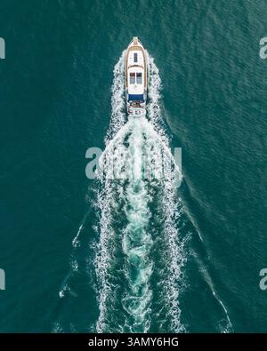 Aerial view of a motorboat along the coast in Procchio, Elba Island ...