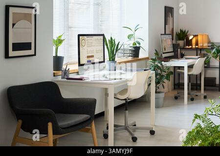 Workplaces With Computers In Modern Office Stock Photo