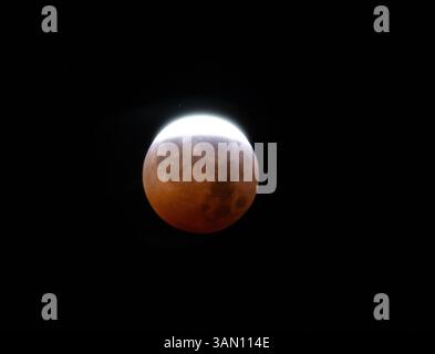 Total Lunar Eclipse of The Red Moon with a Black Background Stock Photo