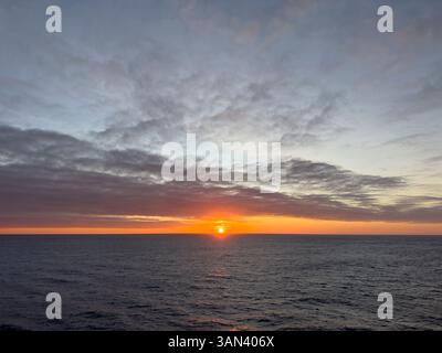 Sunset over the sea with the the horizon in the Caribbean Stock Photo