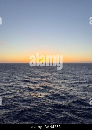 Sunset over the sea with the the horizon in the Caribbean Stock Photo