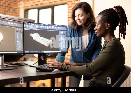 African american artist discussing geometry error with coworker, working together in fixing technical problem. Caucasian team leader identifying a mesh issue and guiding a colleague on the solution. Stock Photo