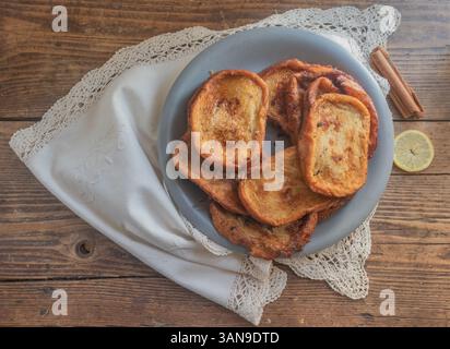 Traditional Spanish Torrijas on a rustic table. Stock Photo