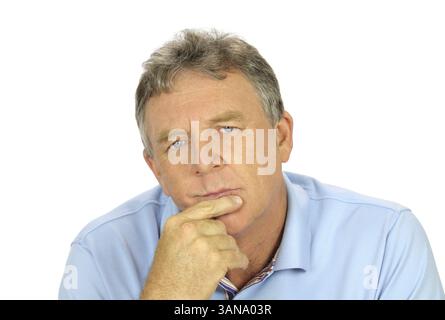 Casual middle aged man with hand on chin with a concerned look Stock Photo