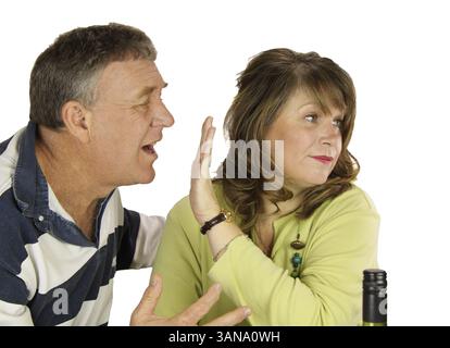 Unhappy middle aged couple arguing over lunch Stock Photo